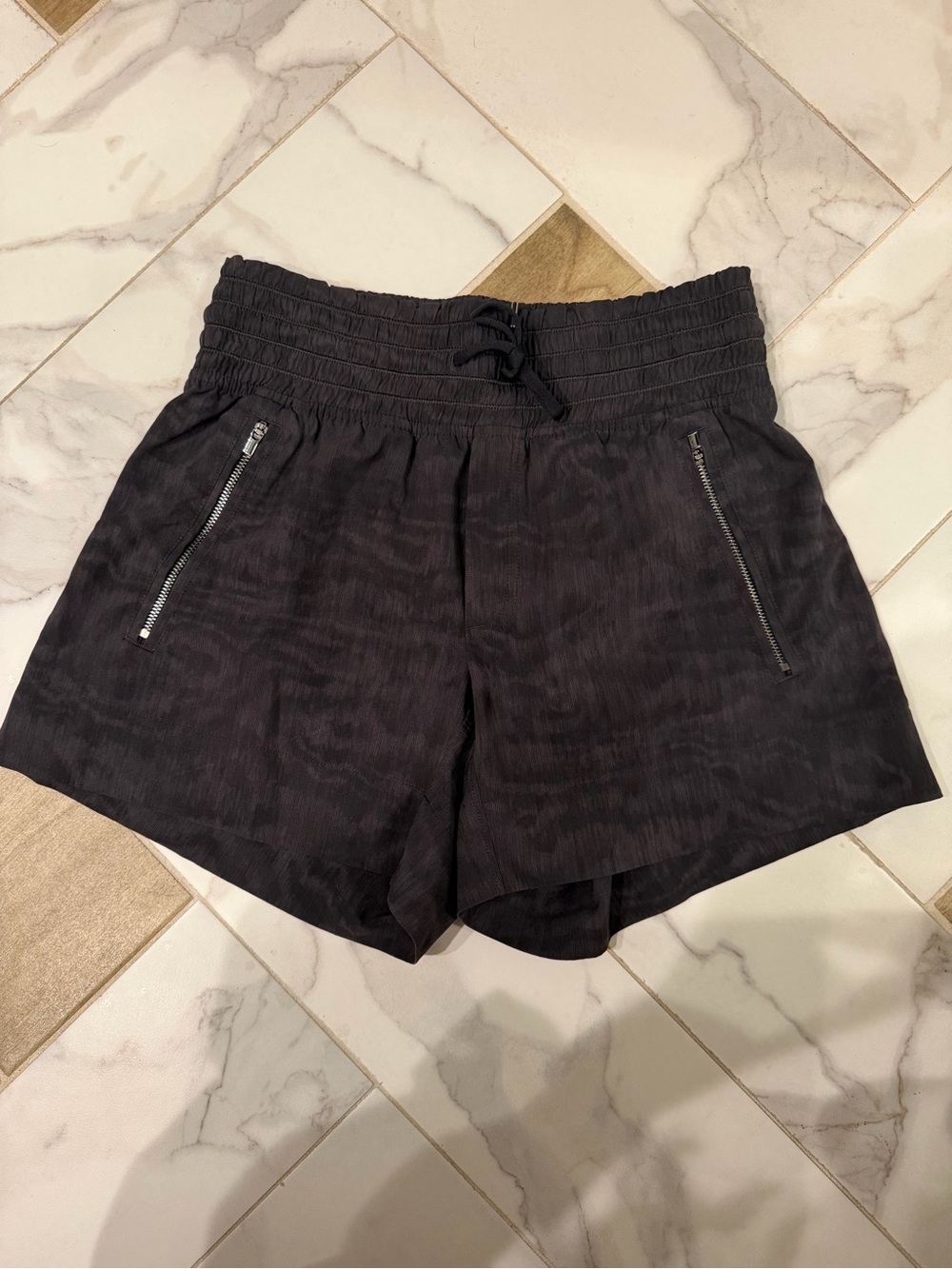 Athleta Black-Patterned Smocked Waist Athletic Shorts with Zip Pockets